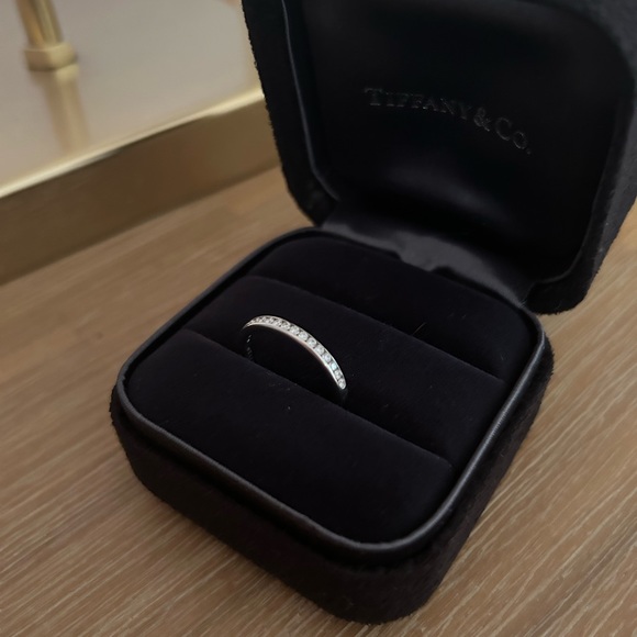 Tiffany & Co. Platinum and diamond half circle band ring. Total .17 ct